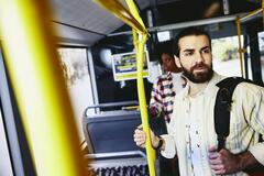 Man standing in bus.